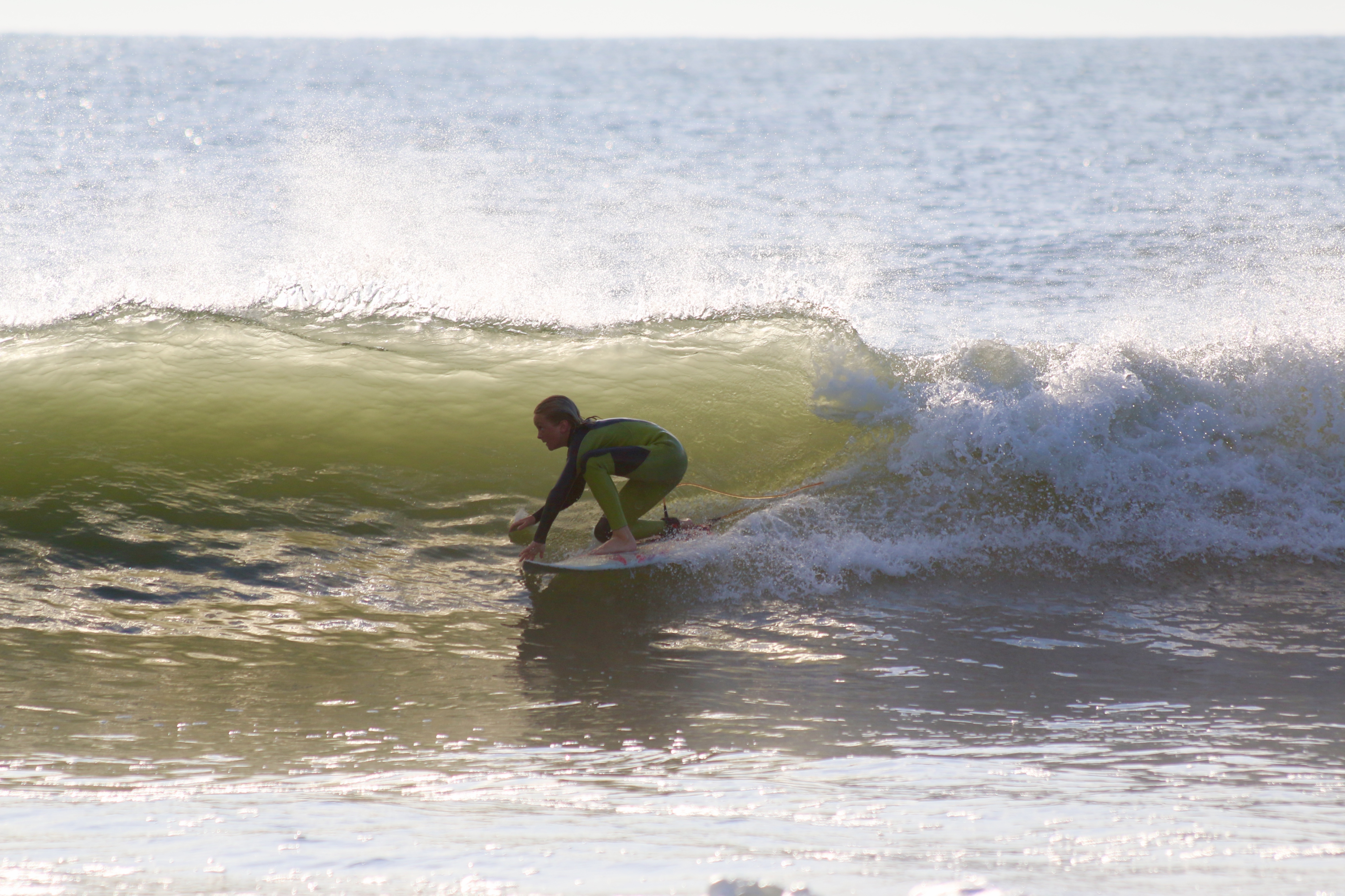 Even the little guys have to drop a knee to make the most of a clean south swell.