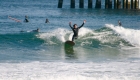 Evan Micele surfing a longboard in Virginia Beach.