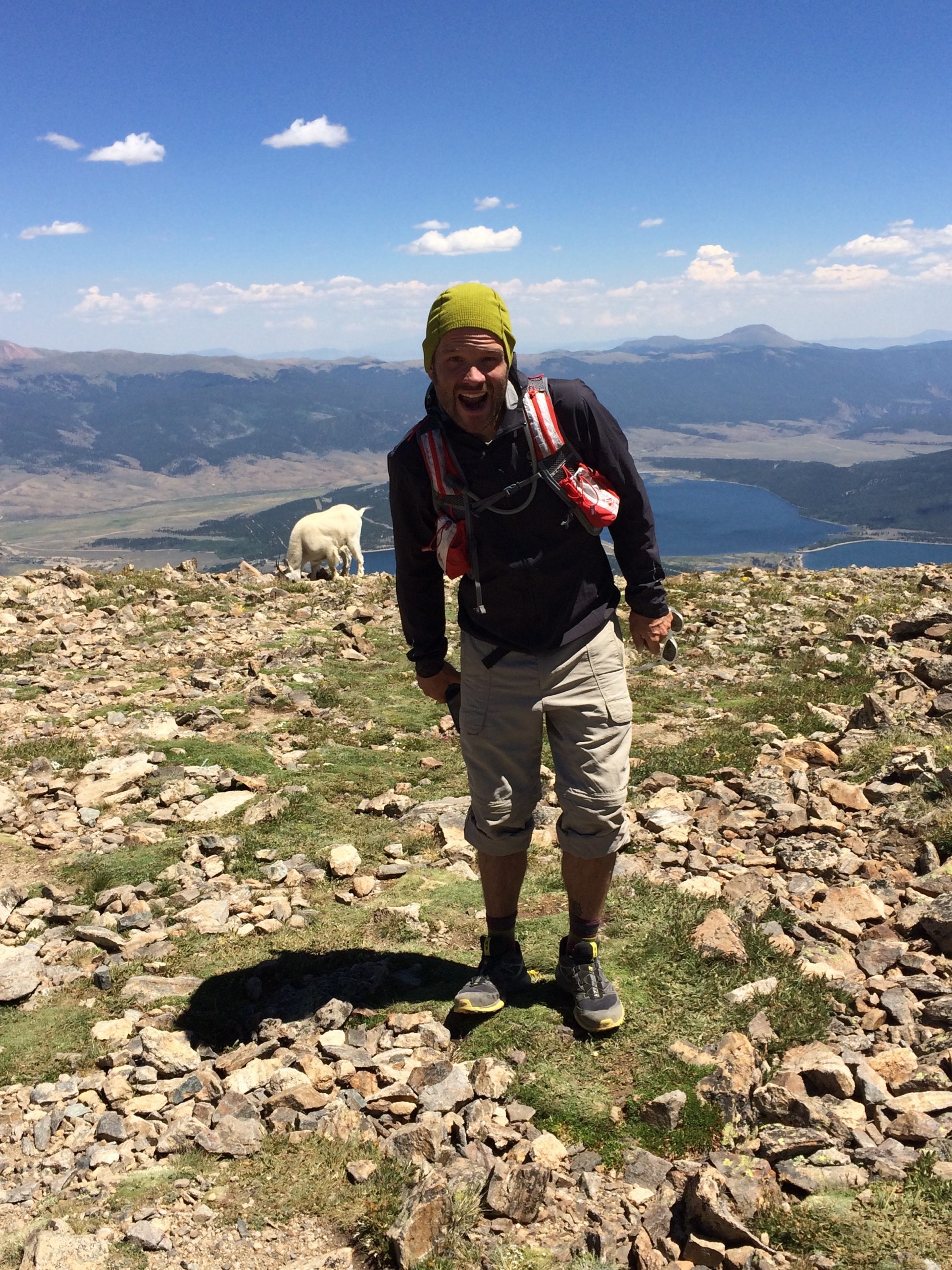 Heath Scott on the peak of Mt Elbert (Colorado's highest mountain, 14,439 ft), shadowboxing with a mountain goat. Photo credit: Lauren Koutavas